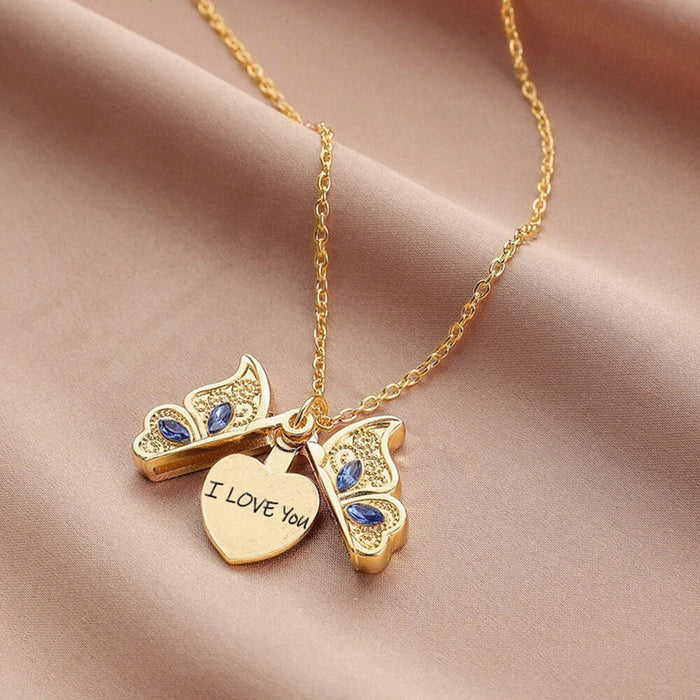 Engravable gold butterfly pendant necklace with heart charm inscribed "I LOVE YOU," perfect for gifting.