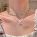 LATS Romantic Blue Crystal Butterfly Necklace worn as a dual-layer choker, showcasing elegant design and shimmering zircon accents.