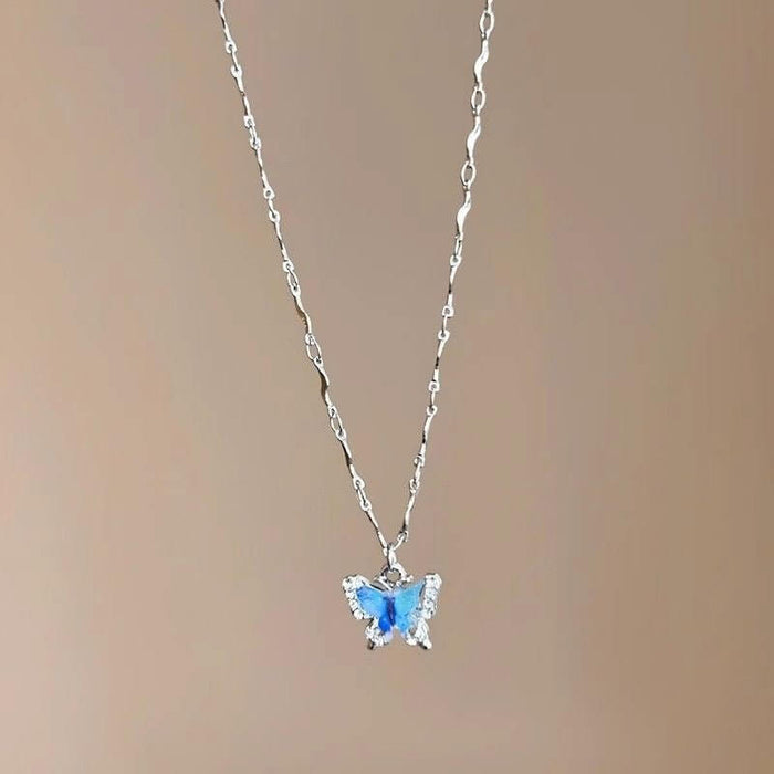 LATS Romantic Blue Crystal Butterfly Necklace showcasing a zircon butterfly pendant on a silver choker chain.