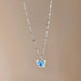 LATS Romantic Blue Crystal Butterfly Necklace showcasing a zircon butterfly pendant on a silver choker chain.